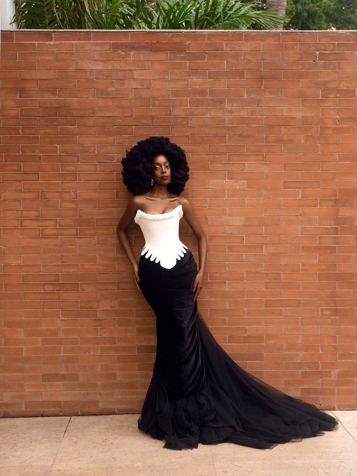 Yollanda Chimbarami standing full length in a black tulle couture gown